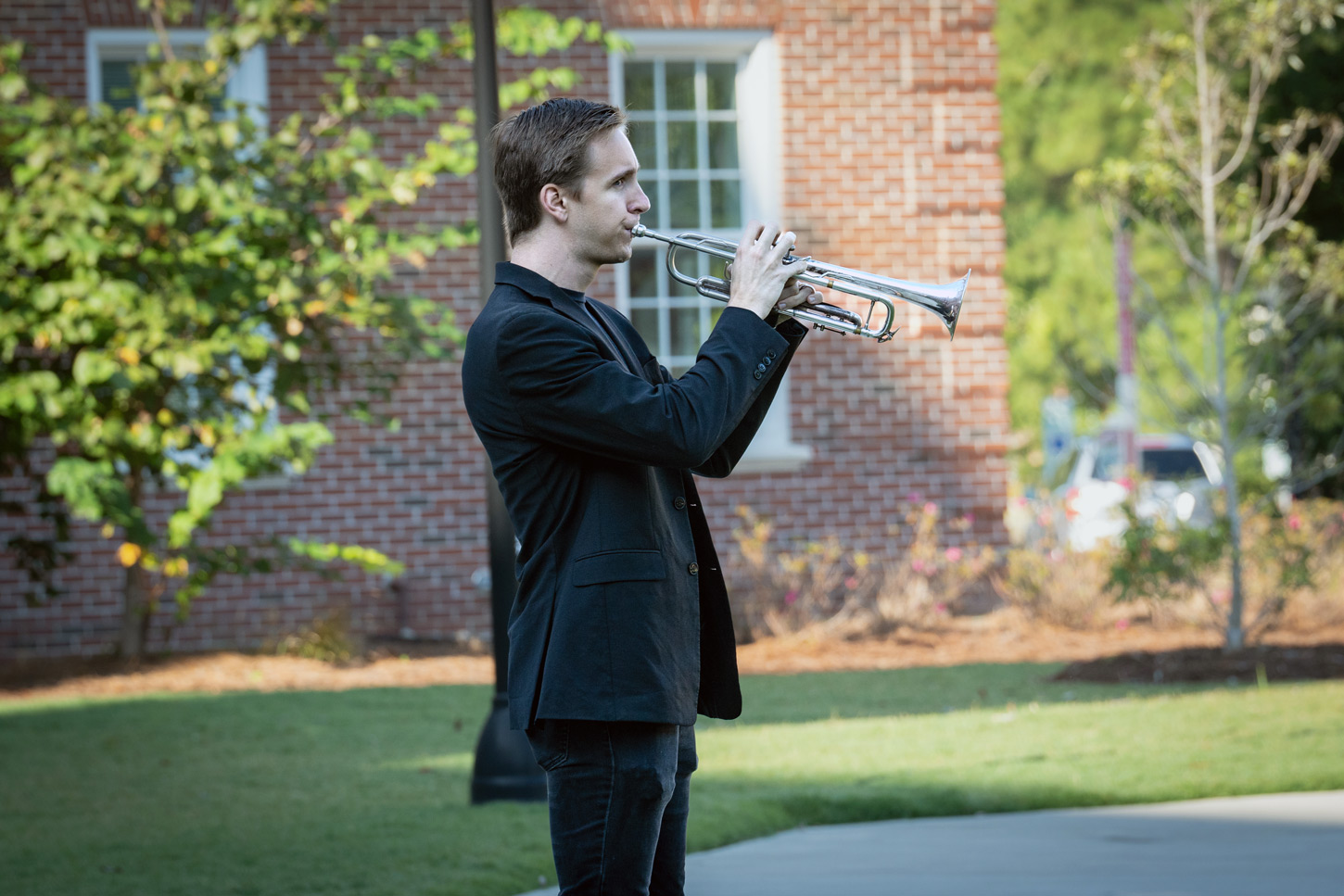 Christopher Luebke-Brown, a UNCW Department of Music lecturer, performs "Taps" at the SVO 9/11 Remembrance Ceremony.