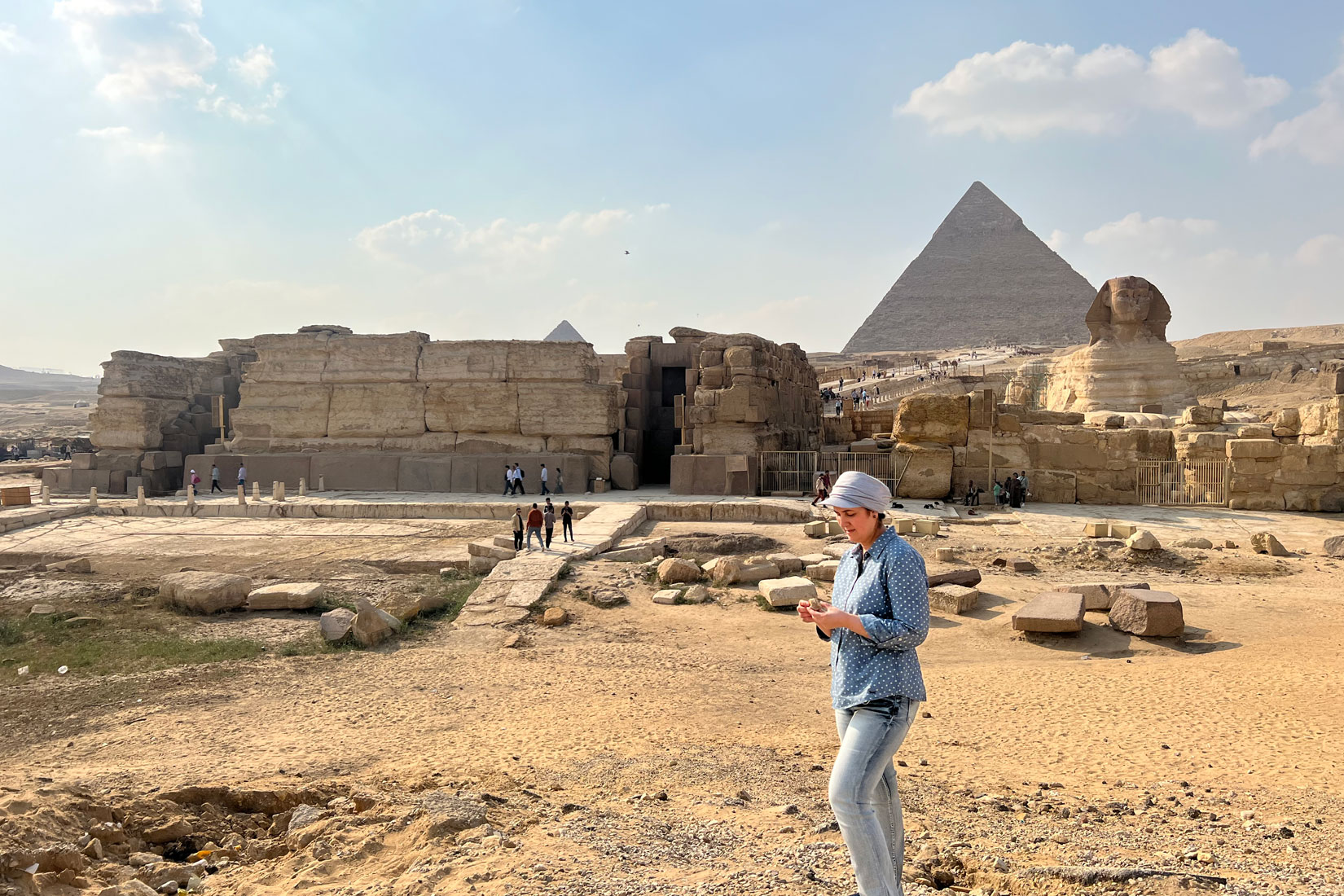 Eman Ghoneim studies the surface topography of the section of the ancient Ahramat Branch located in front of the Pyramids of Giza and the Great Sphinx.