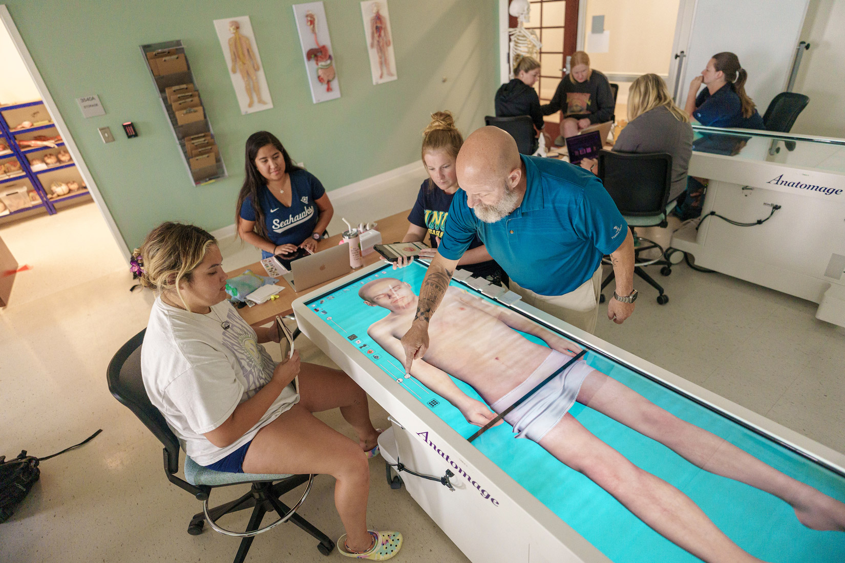 Anatomy students use an Anatomage Table, a 3D visualization and dissection tool. Aided by philanthropic impact, UNCW students will experience high-quality preparation to enhance healthcare within the region.