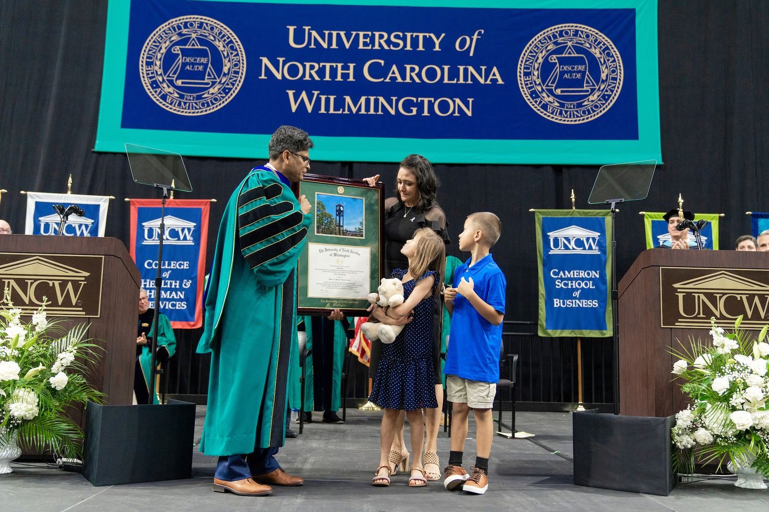 wife, Amy, and two children, Gracie and Maverick, were present to accept Jaime Jay “JJ” Young's posthumous degree.