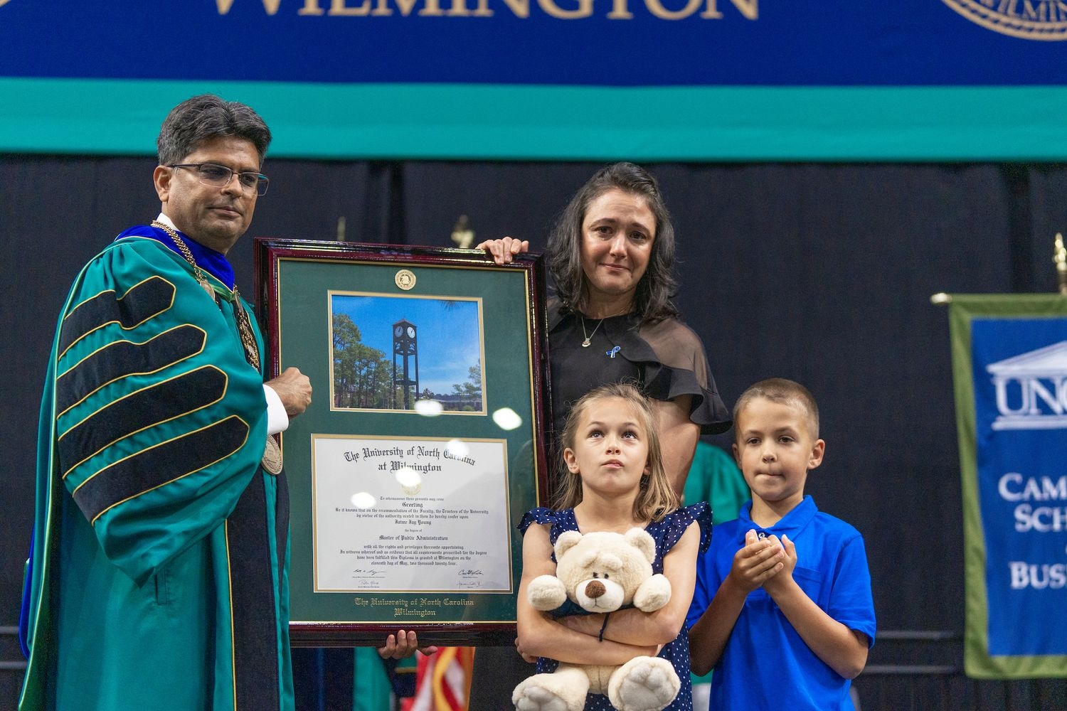 wife, Amy, and two children, Gracie and Maverick, were present to accept Jaime Jay “JJ” Young's posthumous degree.