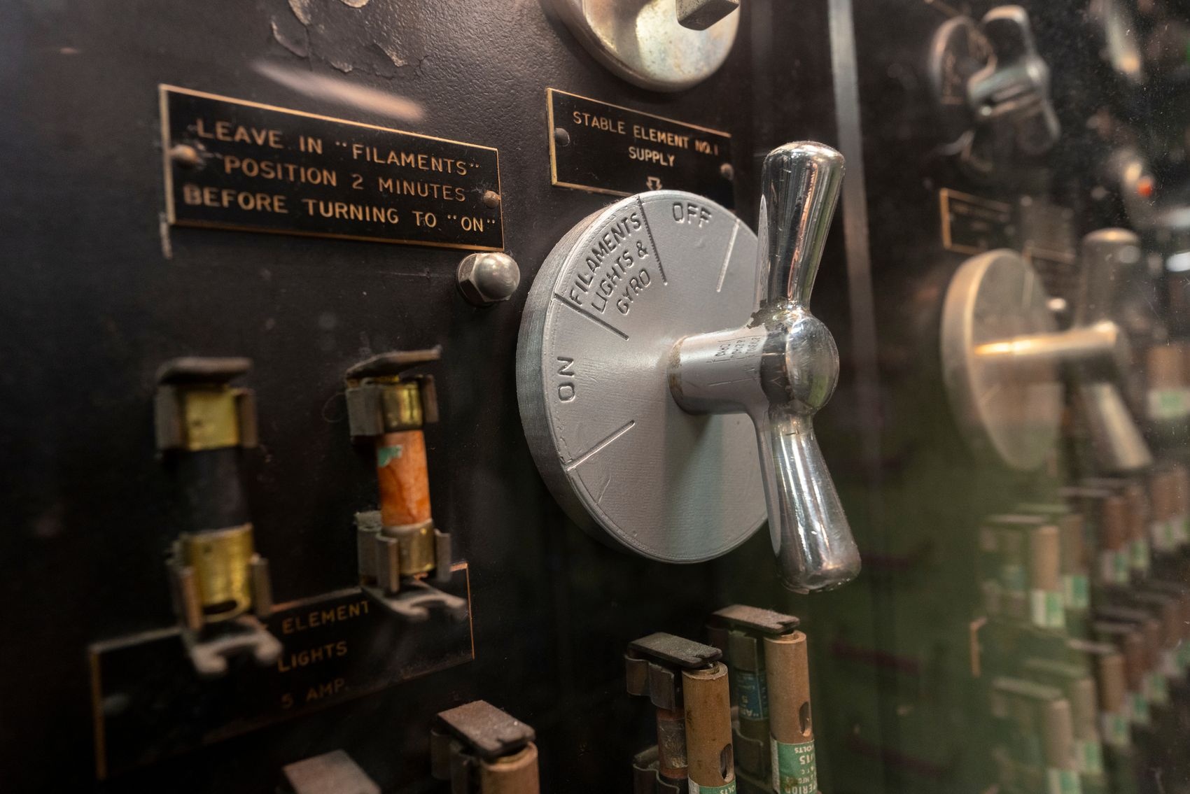 Silver backplate on ship's electric board