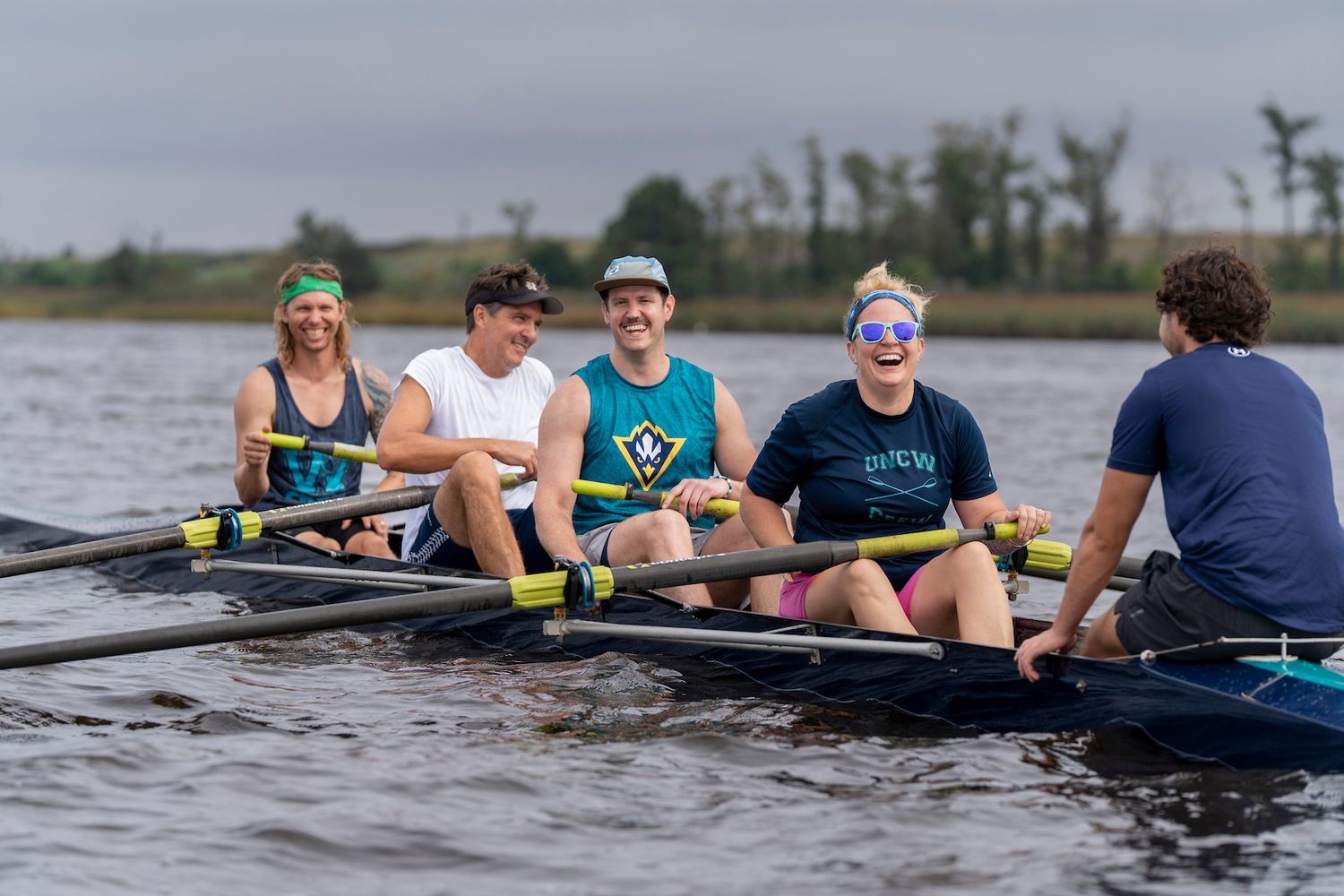 The UNCW Rowing Club gathered with alumni and launched its boats at Belville Riverwalk Park.