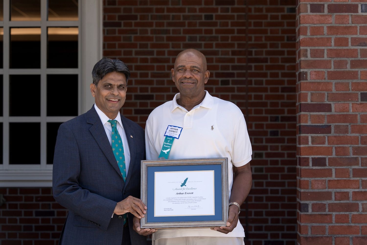 The 2026 Staff Award for Excellence recipient Arthur Everett is pictured with UNCW Chancellor Aswani K. Volety.