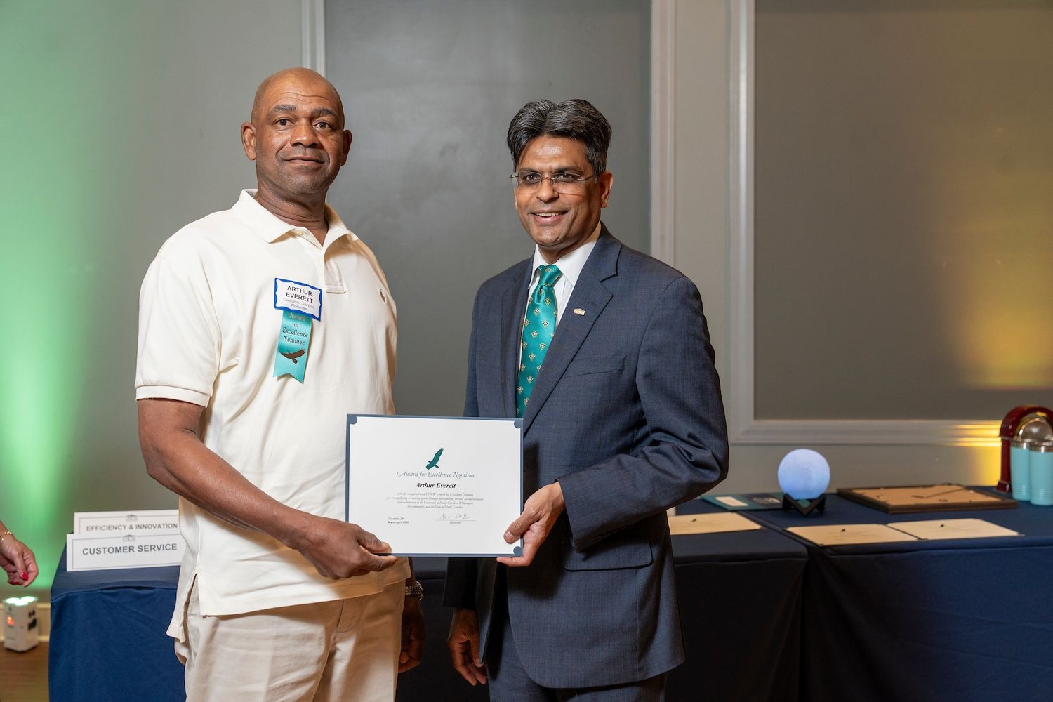 The 2026 Staff Award for Excellence recipient Arthur Everett is pictured with UNCW Chancellor Aswani K. Volety.