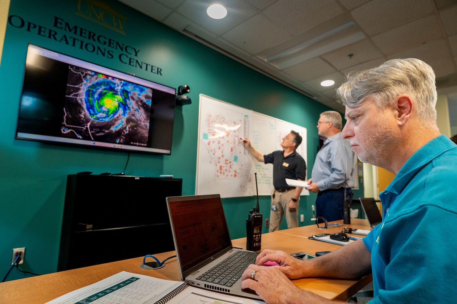 UNCW's Environmental Health and Safety staff members assemble in the Emergency Operations Center on the university's campus. 