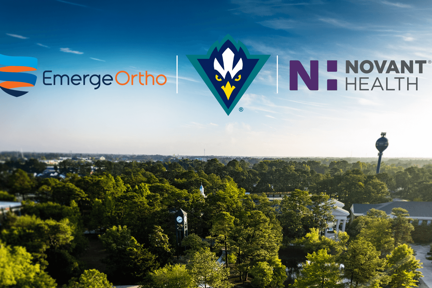 Ariel photo of the UNCW campus with the logos for EmergeOrtho, UNCW Athletics and Novant Health