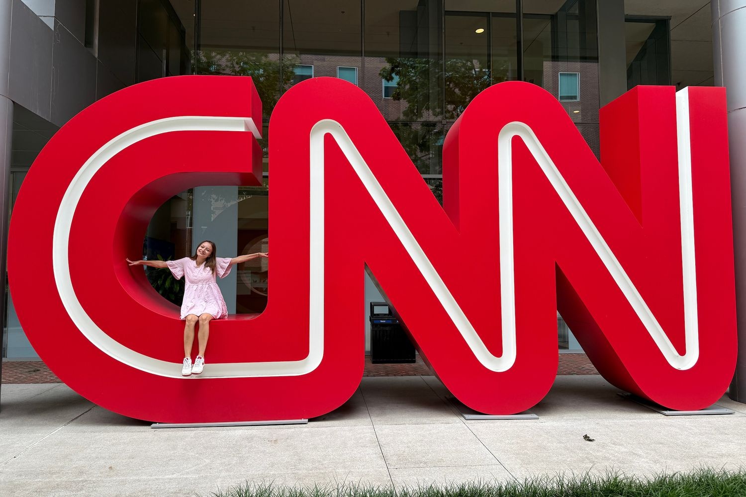 Kaitlyn Meehan '26 poses in front of CNN headquarters 