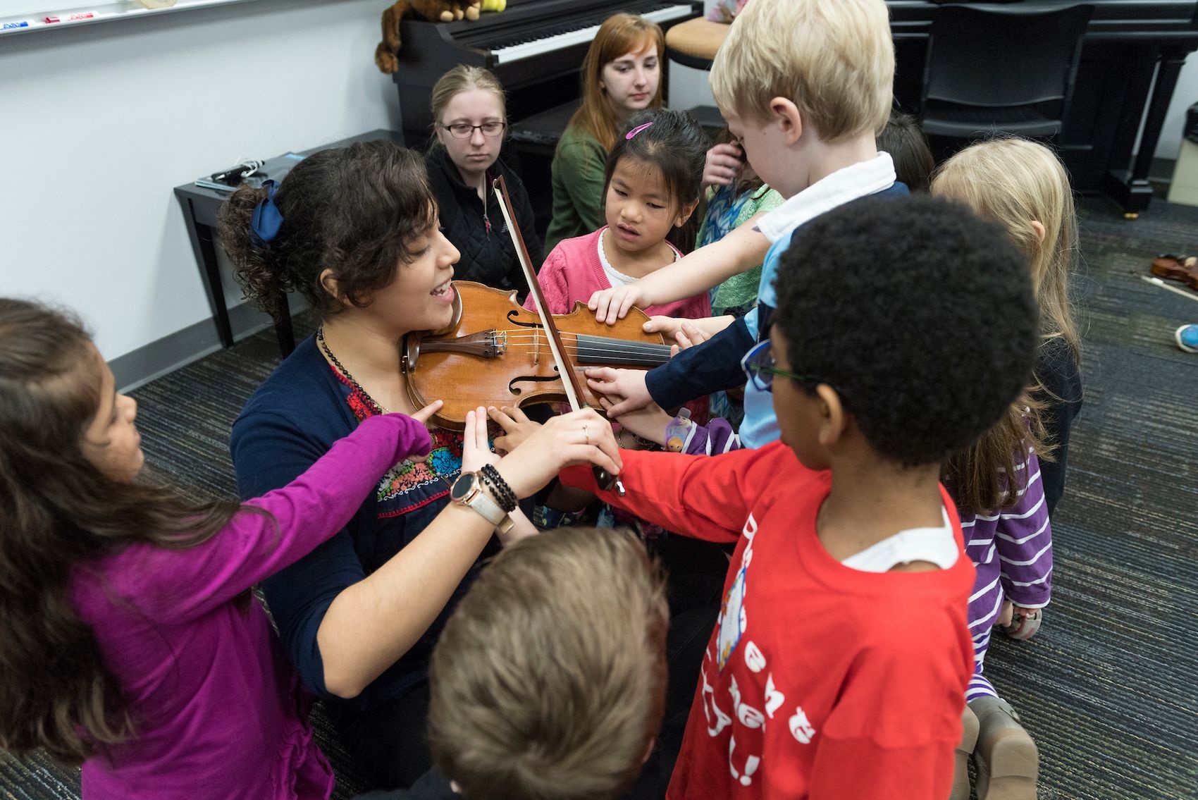 Marscia Martinez-Mendoza is a UNCW student who workds with students ages 4-60 to learn to play the violin.