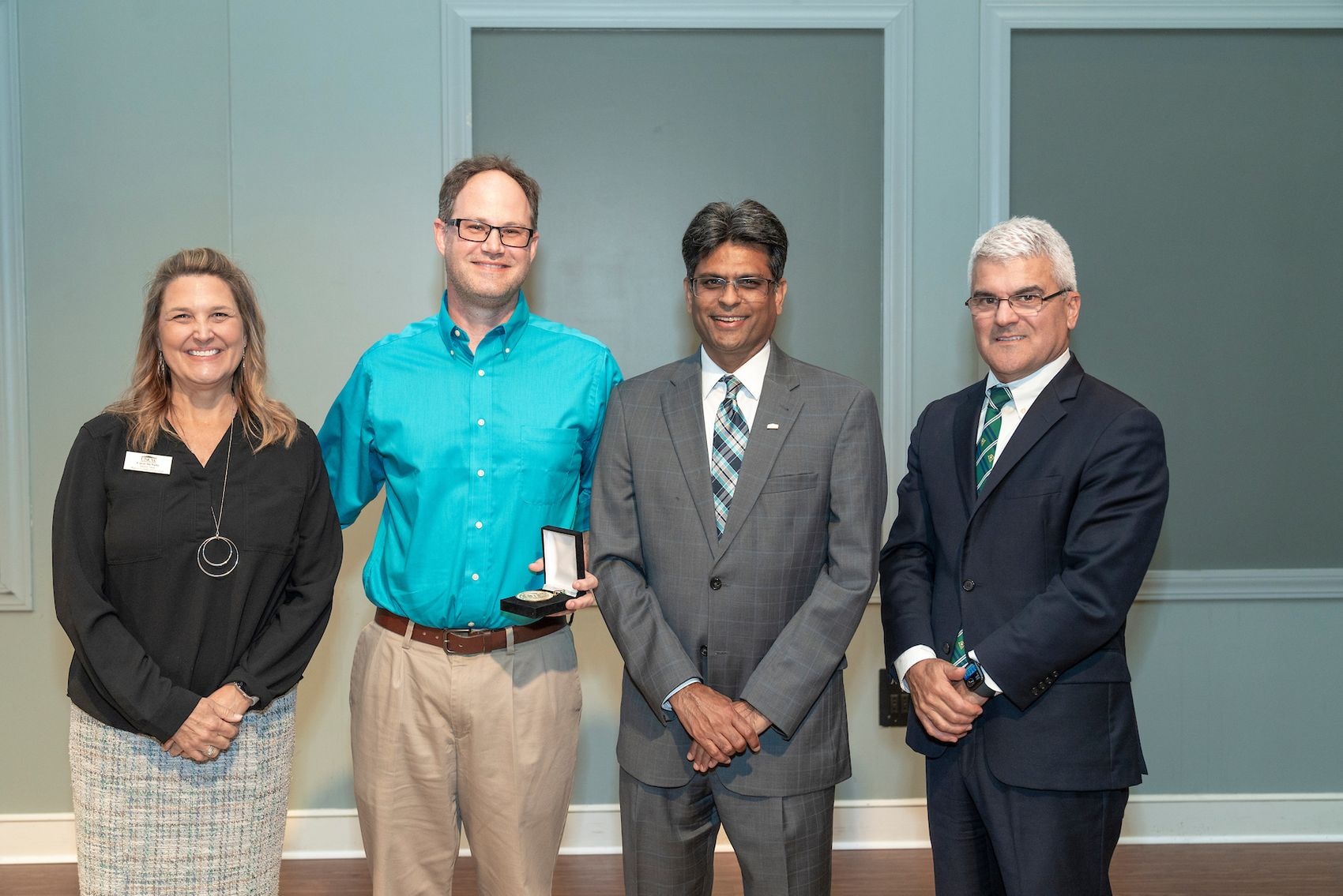 Hosted by Office of Faculty Affairs, UNCW honors faculty excellence during an awards reception at Burney Center May 2, 2024. Jeremy Hilburn, professor, Department of Early Childhood, Elementary, Middle, Literacy, and Special Education receives the Chancellors Teaching Excellence Award.