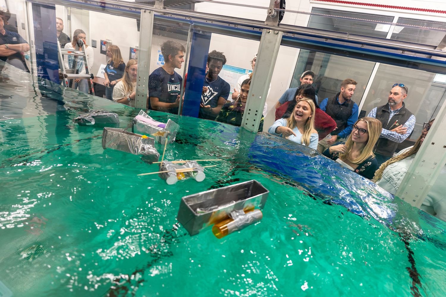 Engineering students worked in teams to build boats with the provided materials at the first annual UNCW Coastal Engineering Wave Flume Boat Race.