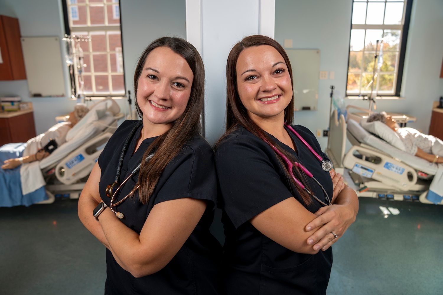 Twin sisters and UNCW alumnae Julie Teachey (left) and Sarah Kelly (right)  bring their shared passion for nursing to a rural hospital where patients often do a double take.