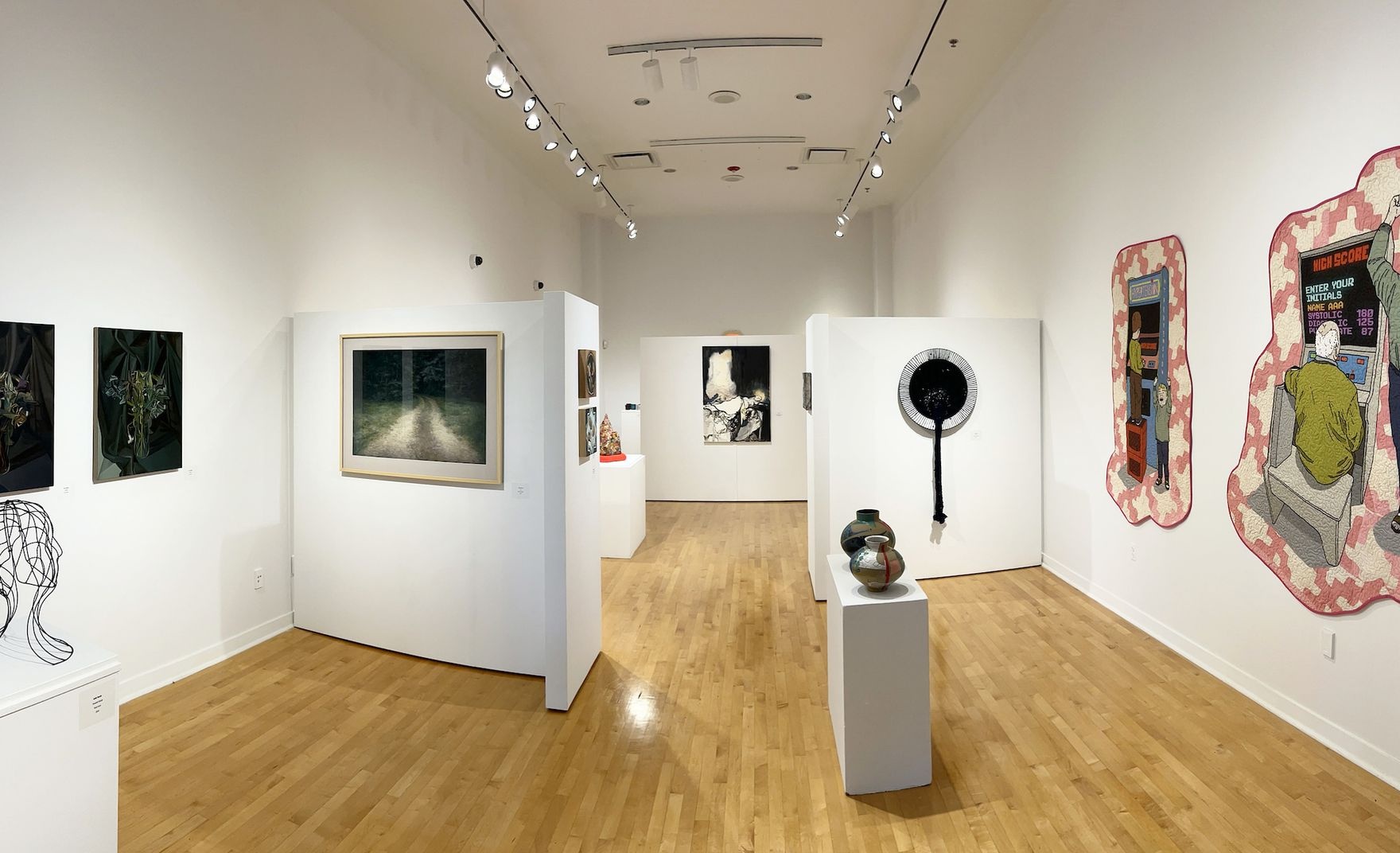 Art gallery with many pieces of art on display