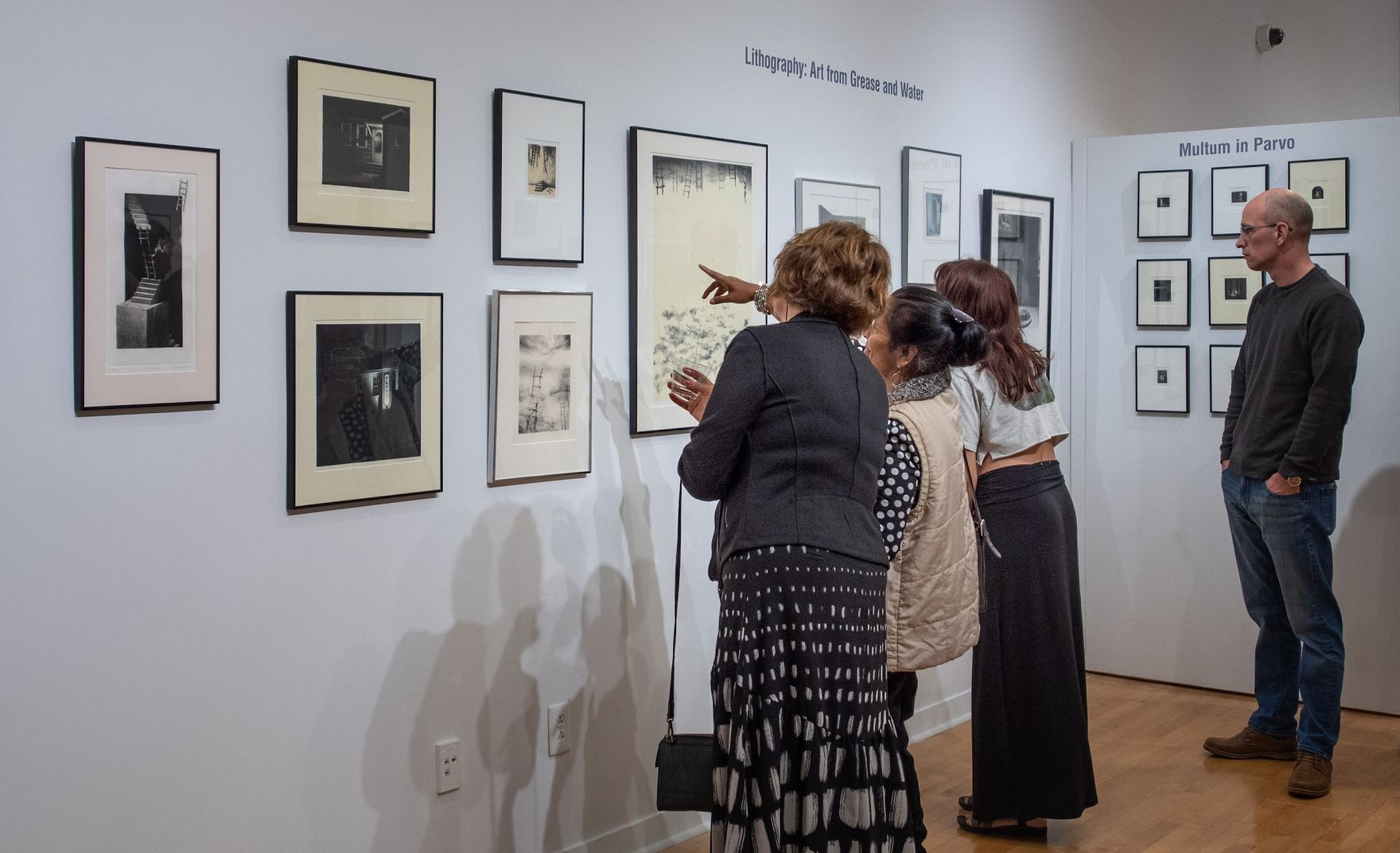 Participants discussing various art pieces