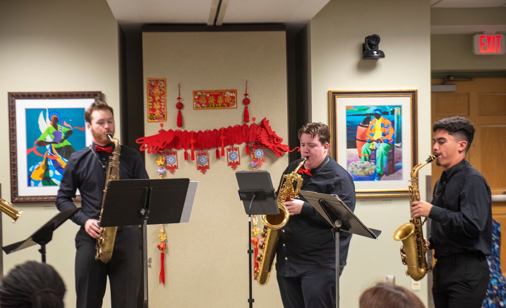 3 saxophonists play at an AHCC event