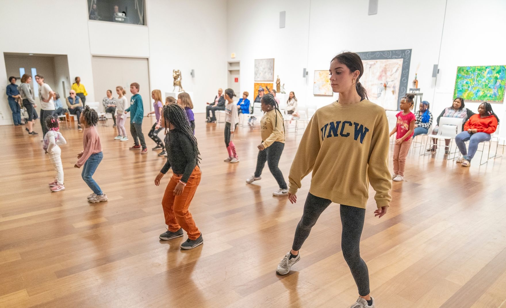 UNCW Student joins youth participants in dance during class