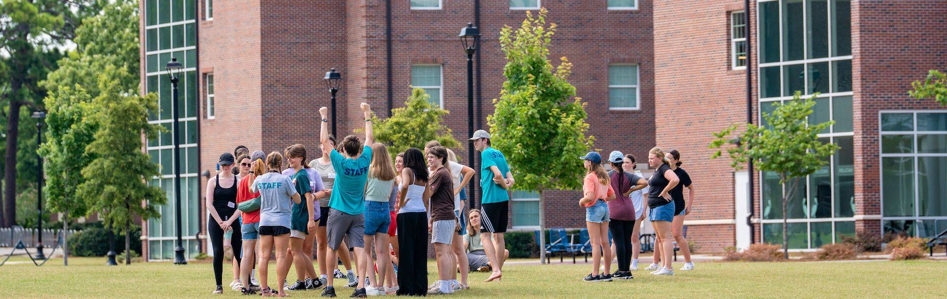Group of students celebrating outside together