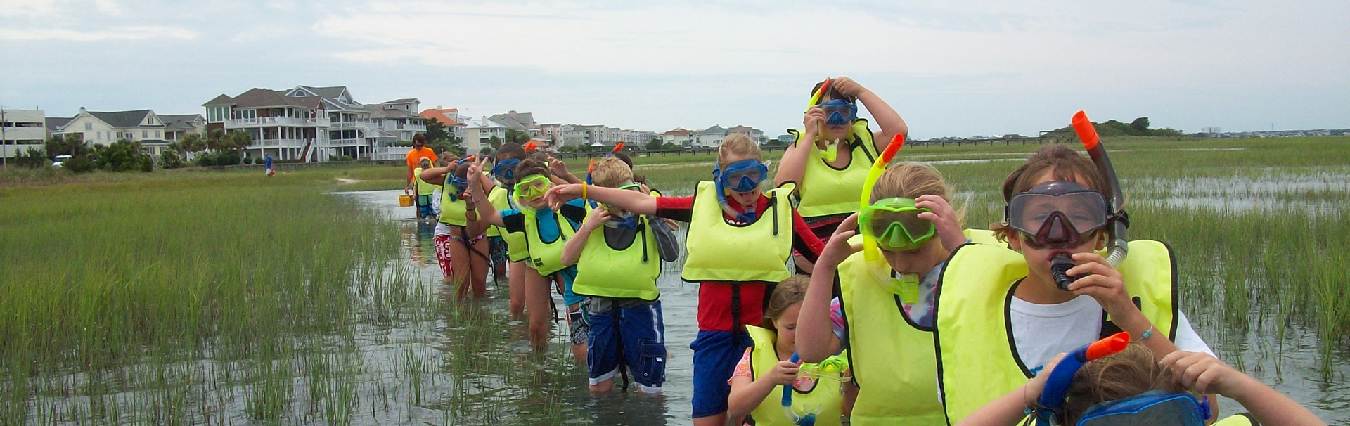 students wearing snorkels and life vests on field trip