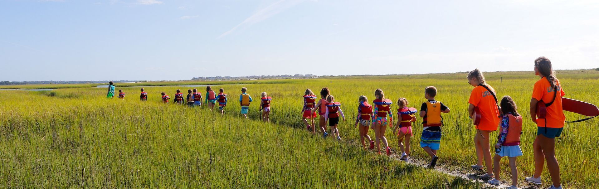 students wearing snorkels and life vests on field trip