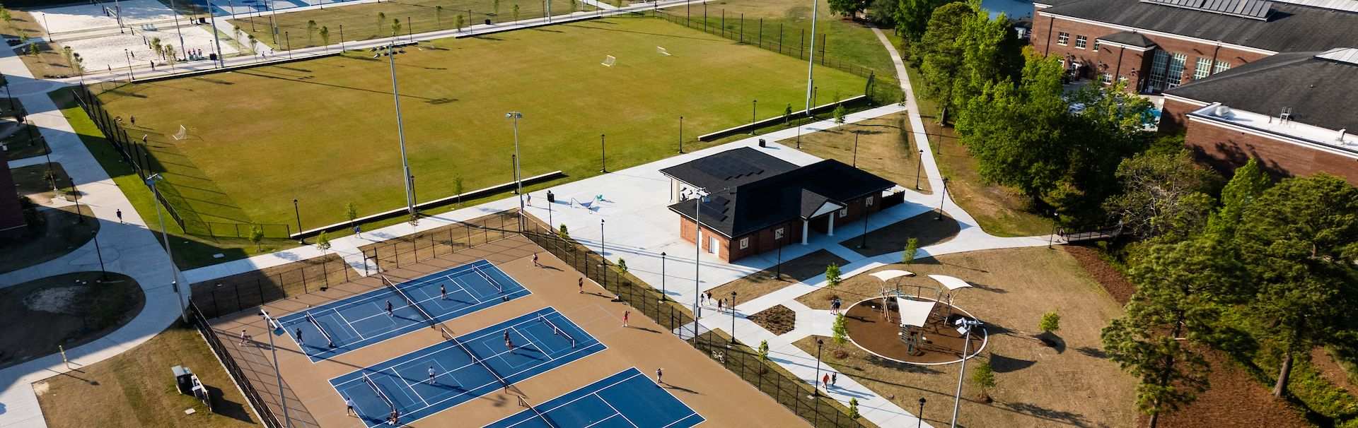 Campus Recreation members are shown participating in a kickboxing group fitness class in the Harris Teeter Functional Training Area