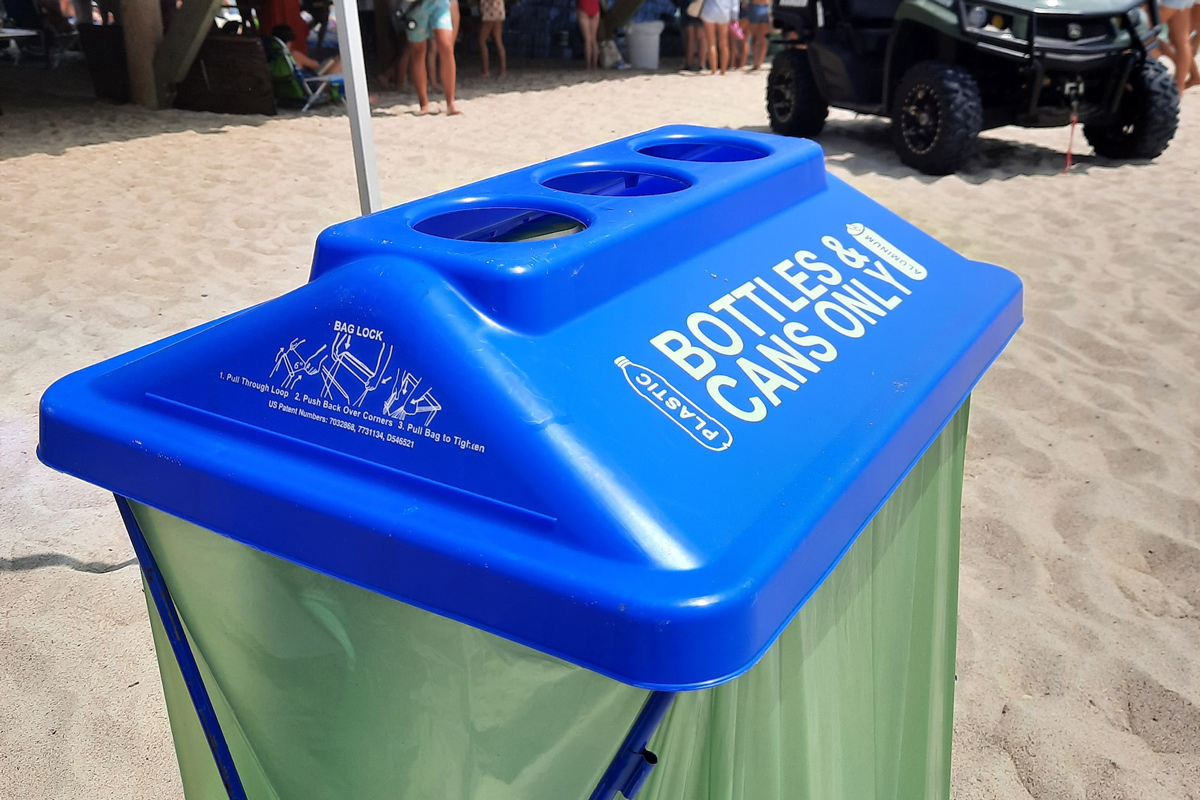bottle and can recycle bin on beach